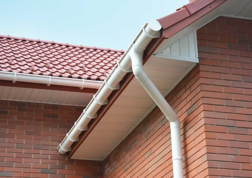 tiled roof white fascias guttering downpipes